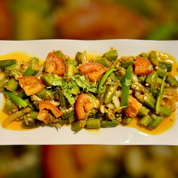 Maza Grill's halal okra dish with tomatoes, onions, and green chilies in a savory sauce.